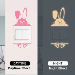 Glow-in-the-dark cute rabbit switch sticker in daytime pink and nighttime yellow glow effect