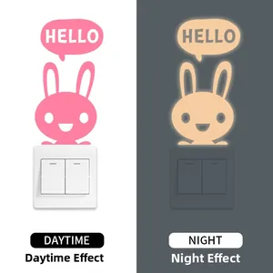 Luminous bunny wall stickers showing day and night glow effects for light switch decor