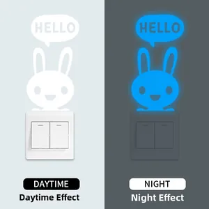 Glow-in-the-dark Hello rabbit wall sticker showing day and night luminous effect on switch