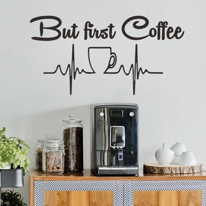 Detail of But First Coffee wall sticker with heartbeat line in a modern home kitchen