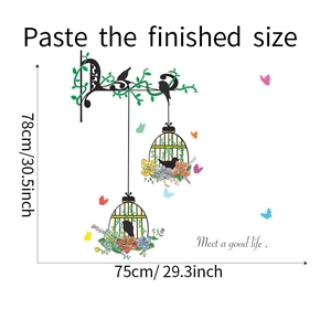 Detail of bird cage wall sticker with flowers and Meet a good life text for home decor