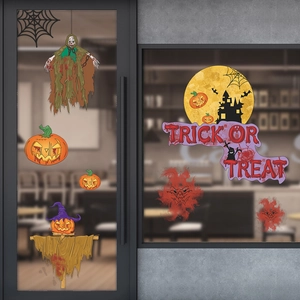 Detail view of Halloween window decals featuring pumpkins and Trick or Treat typography