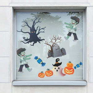 Halloween window decals set with zombie, spooky tree and pumpkins on glass window