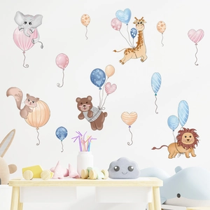 Nursery wall stickers featuring cartoon animals like lions and giraffes with balloons
