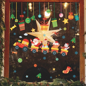 Detailed Christmas window stickers showing Santa Claus and animals on a train