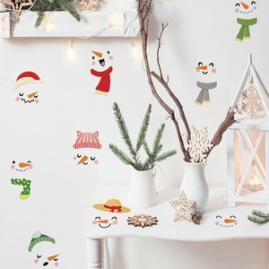 Close-up of DIY snowman Christmas wall stickers set with festive scarves and hats