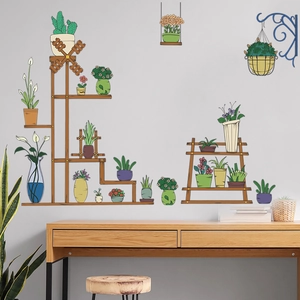 Detail of self-adhesive wall stickers with potted plants and wooden shelf on a grey wall