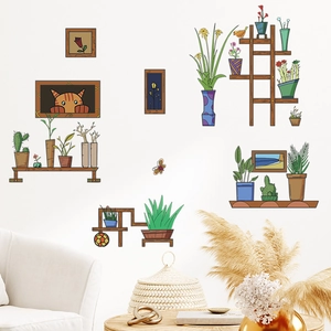 Detail of vintage potted plant wall stickers and cat paintings in a cozy living room decor