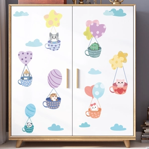 Detail of cute animal coffee cup wall stickers on a white wooden wardrobe surface