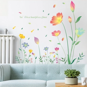 Cosmos floral wall stickers with inspirational quote above a sofa for home decor