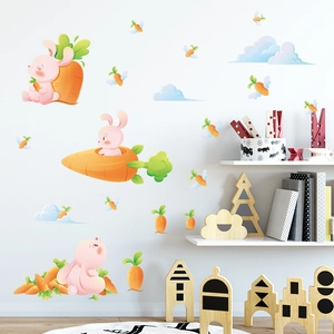 Detailed view of cartoon bunny and carrot wall stickers in a cozy nursery room setting