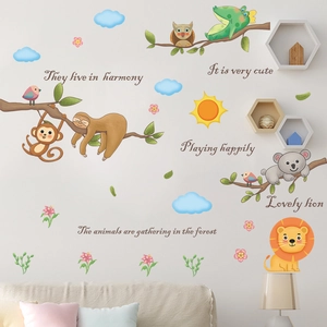 Nursery wall decals featuring cartoon animals and motivational quotes in a cozy living room