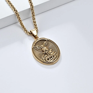 Detailed view of Saint Michael Archangel relief on oval gold-plated stainless steel coin pendant