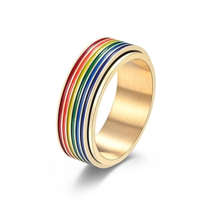 Golden stainless steel spinning ring with vibrant rainbow enamel stripes for pride