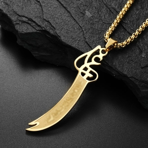 Detailed macro view of gold-plated Zulfiqar sword pendant necklace for men