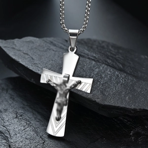 Silver stainless steel crucifix necklace pendant with detailed Jesus figure on dark stone