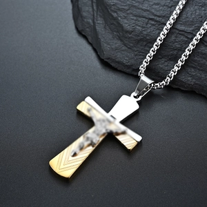 Two-tone stainless steel crucifix necklace with gold-plated Jesus relief on black stone