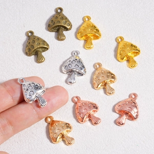 Polished alloy mushroom pendants in various metallic finishes for DIY jewelry making