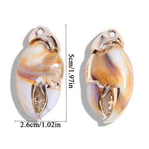 Detailed view of crab claw pendants with marble resin texture and gold metal frame