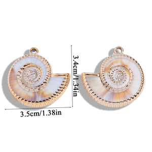 Macro detail of acrylic sea shell pendants with gold edges for DIY jewelry making