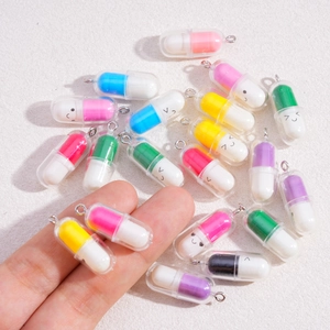 Cute capsule smile face charms made of colorful resin with silver hooks for DIY jewelry making