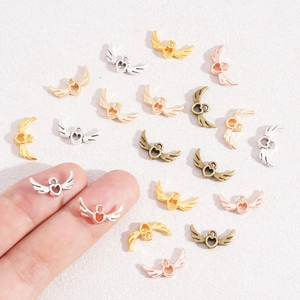 Vintage hollow heart wing alloy charms in gold and silver for DIY jewelry making necklaces