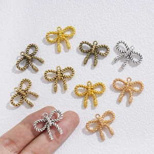 Pendentif nœud vintage en alliage avec texture corde pour colliers DIY en diverses finitions