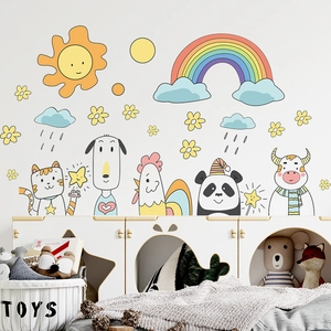 Detailed view of DIY cartoon animal wall stickers with sun and rainbow in a nursery setting