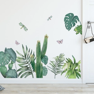 Detail of tropical plant wall stickers with watercolor monstera leaves and dragonflies