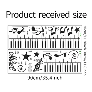 Plan détaillé des dimensions du sticker toise musicale avec touches de piano et étoiles