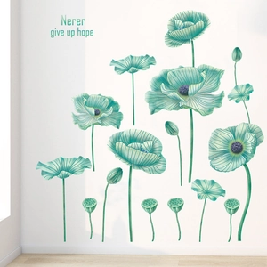 Detail of blue-green floral wall stickers with 'Never give up hope' artistic text