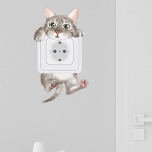 Close-up of a cute gray striped cartoon cat wall sticker around a light switch