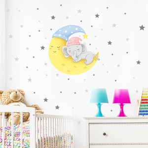 Detailed view of cartoon elephant sleeping on a yellow moon wall sticker with grey stars