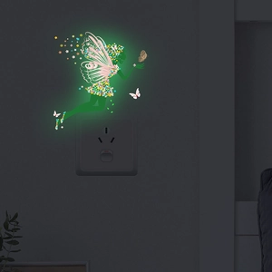 Luminous flower fairy and butterfly wall sticker glowing in dark bedroom interior