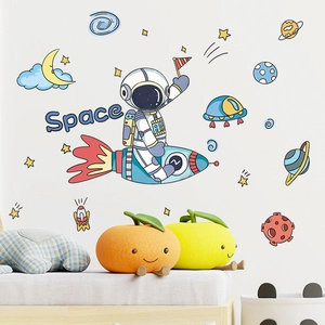 Close-up of cartoon astronaut riding a rocket with planets for kids room wall decor