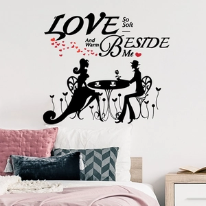 Romantic black couple silhouette wall sticker with red hearts on a bedroom wall