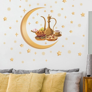 Detail of Ramadan wall sticker with golden crescent moon and traditional Arabic tea set