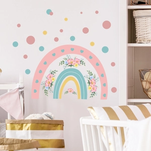 Pastel rainbow wall decals with flowers and hearts for cozy nursery or playroom decor