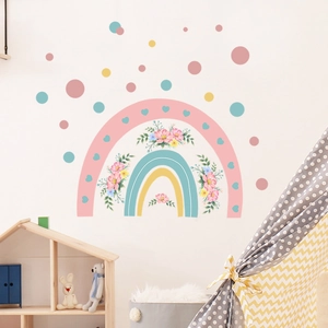 Detail of Morandi-colored rainbow wall decals with floral accents in a nursery setting