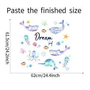 Detail of aquatic wall decals featuring watercolor whales and jellyfish for nursery decor