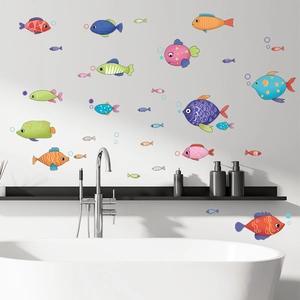 Vibrant cartoon fish wall stickers with bubbles on a clean white bathroom tile wall