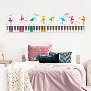 Detail of colorful ballet dancers silhouettes with piano keys and musical notes wall decal