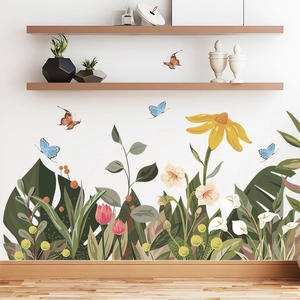Tropical green plants and yellow daisy wall stickers in a modern living room setting