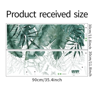 Detail view of tropical green leaf wall stickers with monstera and banana leaf patterns