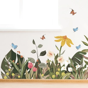 Detail of self-adhesive wall stickers with sunflowers, green leaves and colorful butterflies