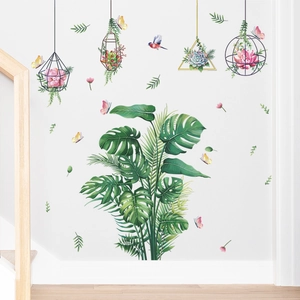 Detail of tropical monstera wall sticker with hanging succulents and colorful butterflies