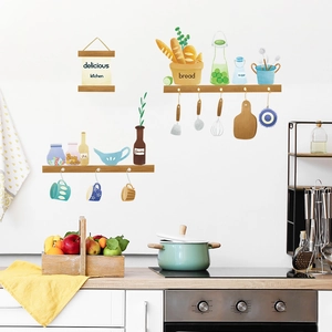 Detail of hand-drawn kitchen wall decals showing cooking utensils and decorative labels