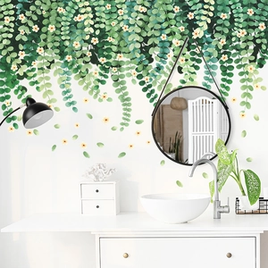 Detail of ivy leaf wall decal with yellow flowers applied on a modern bathroom wall