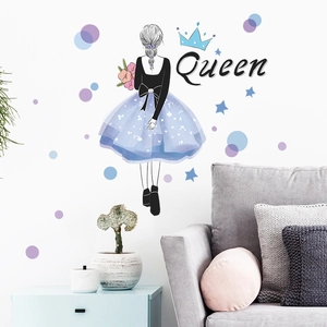 Detail of self-adhesive wall sticker showing a girl holding flowers and Queen lettering