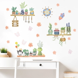 Detailed view of cartoon plant wall stickers with watercolor succulent pots and penguins